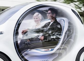 Un paseo en un coche sin conductor Imagen de dos personas a bordo de un coche autónomo