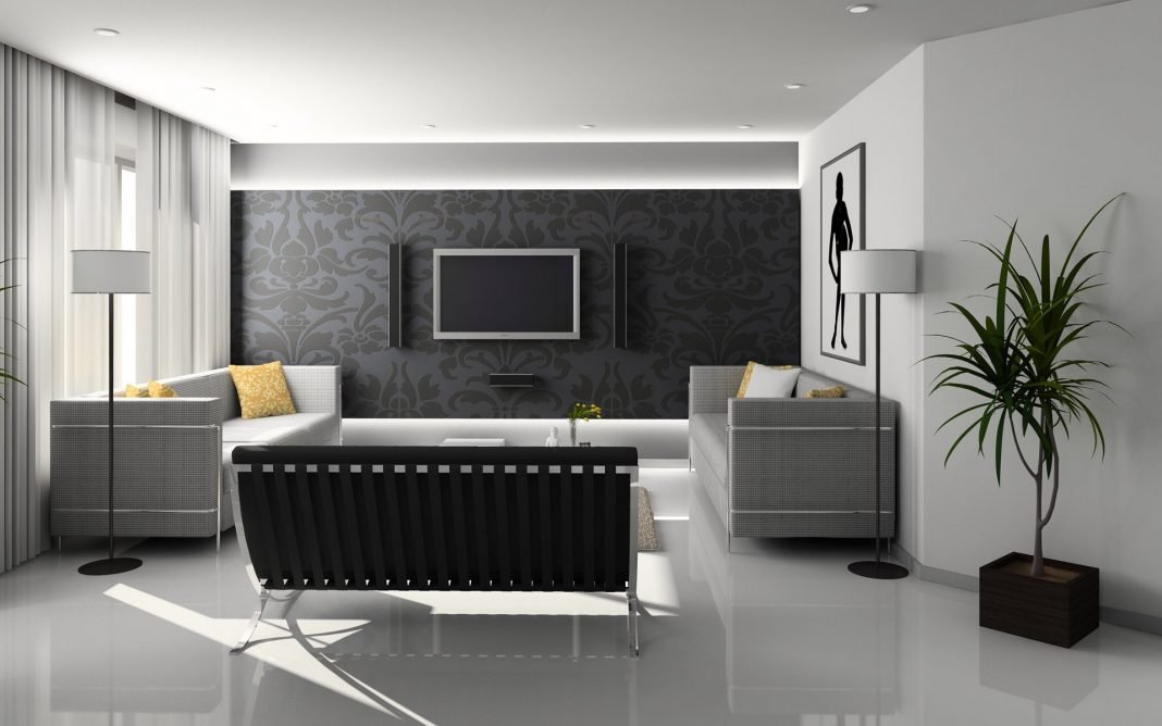 Smart TV Interior de un salón doméstico de diseño moderno y minimalista, con muebles de trazos rectos y predominio de colores claros en paredes y suelo que contrasta con el oscuro de los muebles