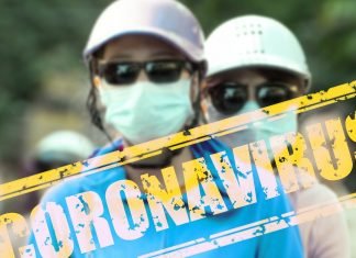 Y una ración extra de Coronavirus Imagen de dos personas con mascarillas en la cara